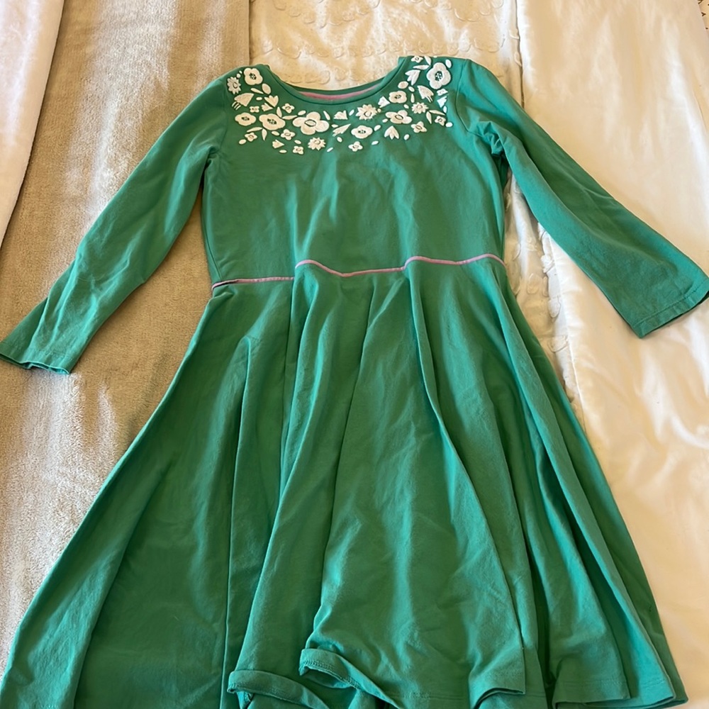 Green dress with white embroidered flowers along the top from mini Boden.